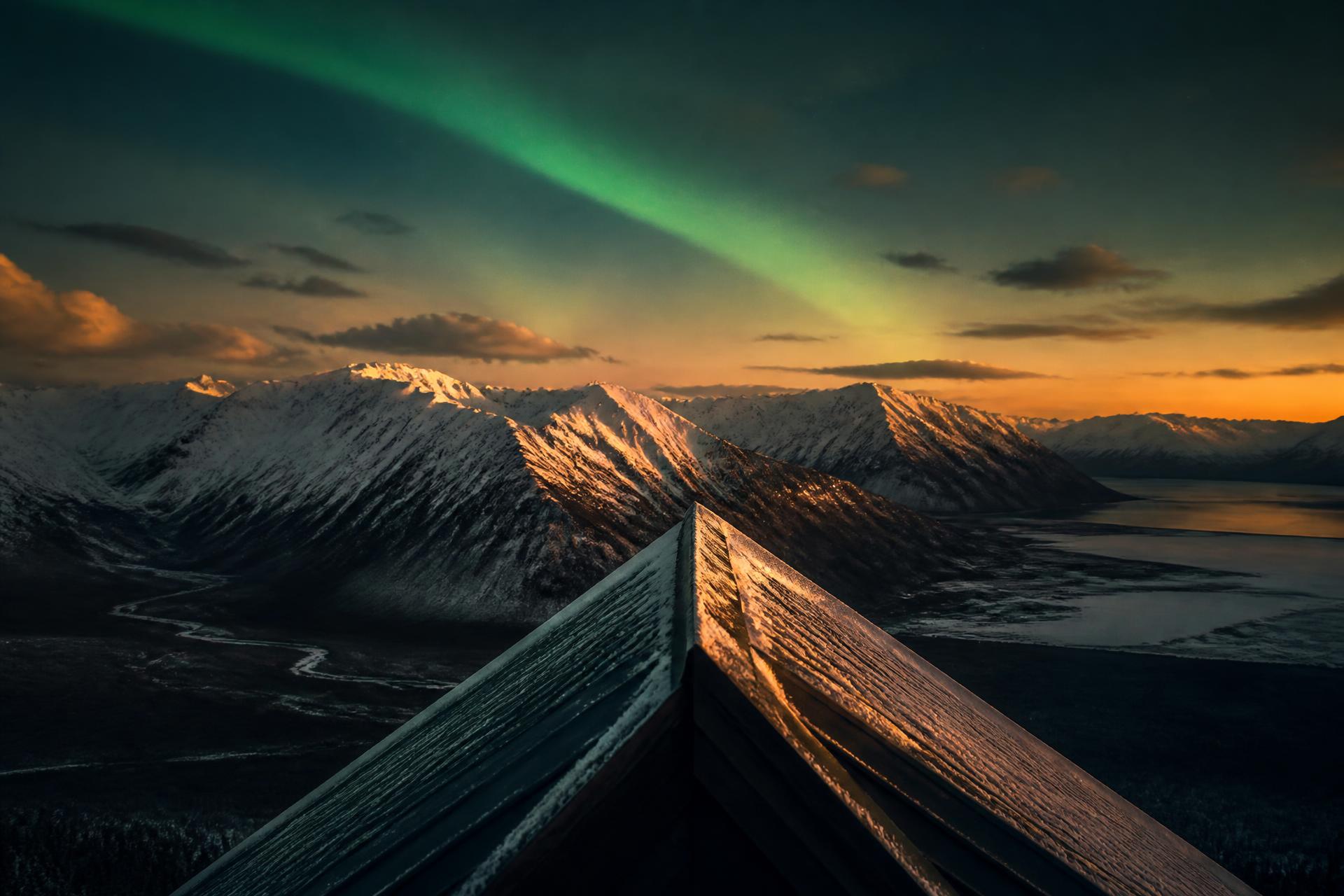 Metal roofing against the Alaska Range at dusk